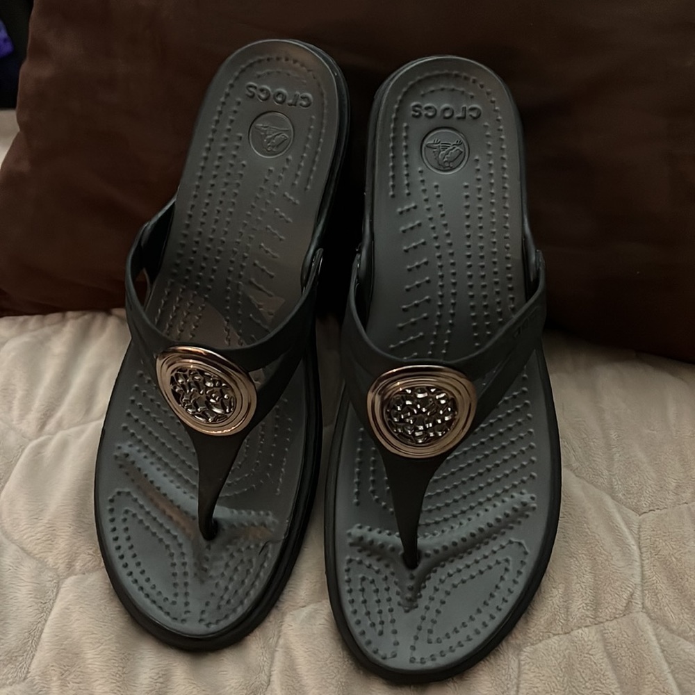 Croc sandals with design in strap.